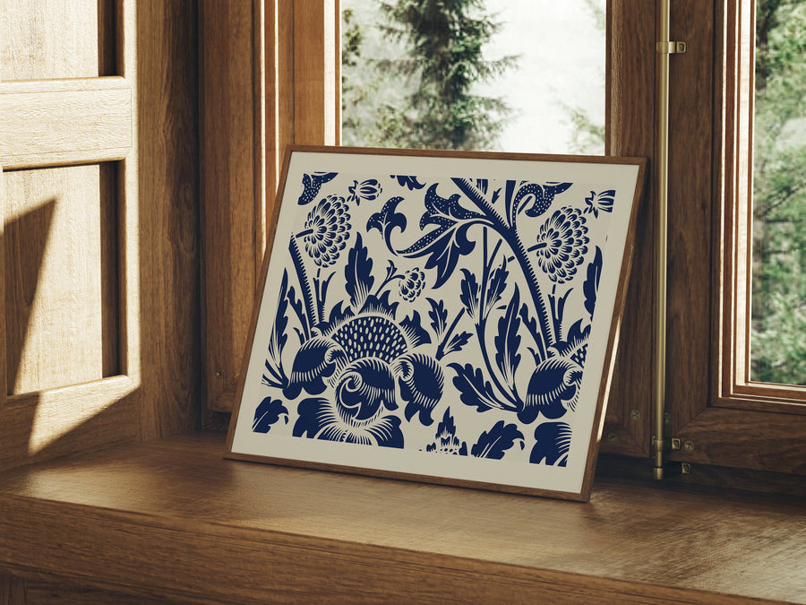 A horizontal wood frame mockup displayed on a window sill, showcasing a blue floral pattern art print.